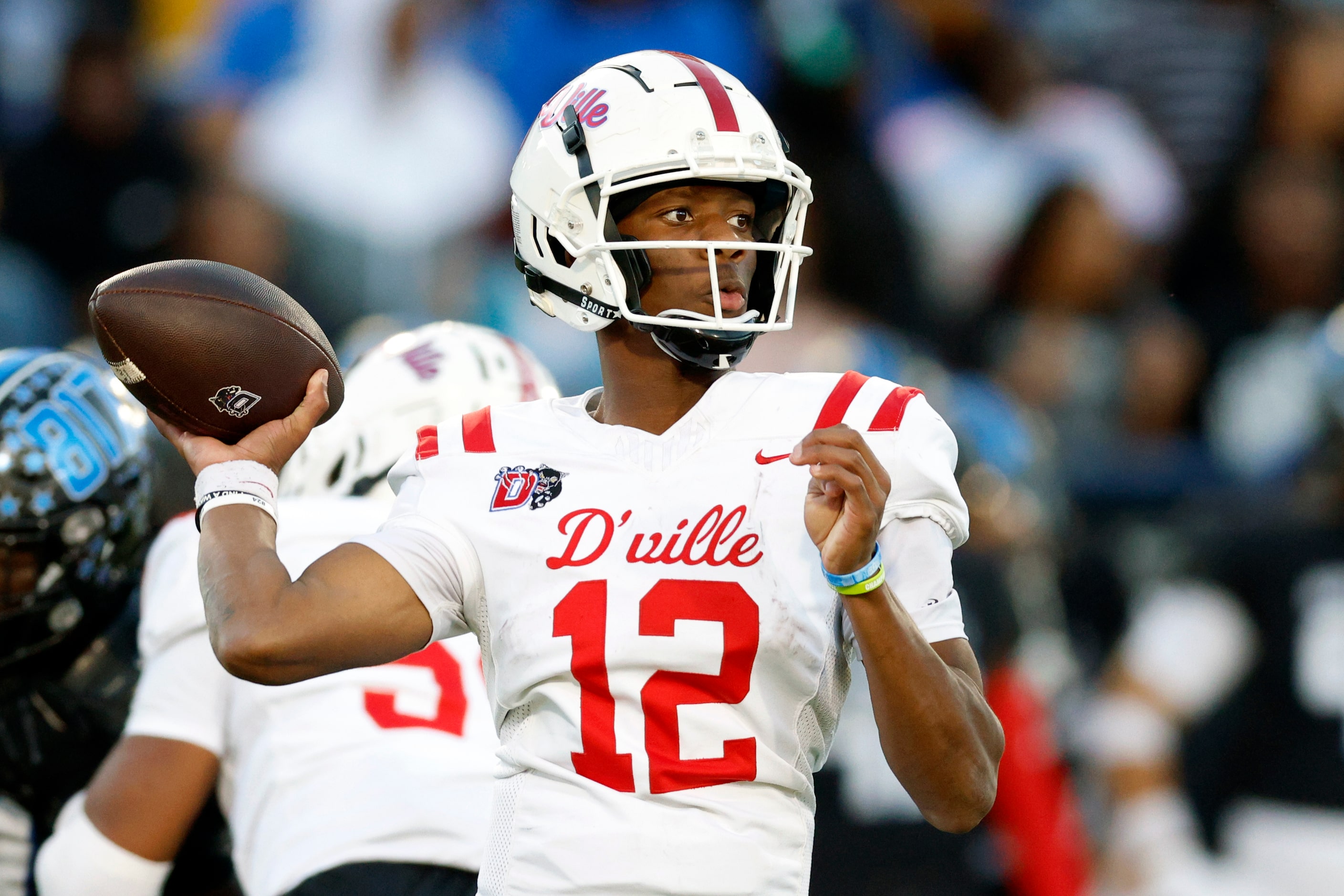 Duncanville quarterback Keelon Russell (12) drops back to pass during the second half of a...