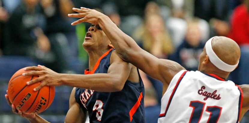 Allen High School forward Myles Nesbitt (11) was called for a shooting foul on Wakeland...