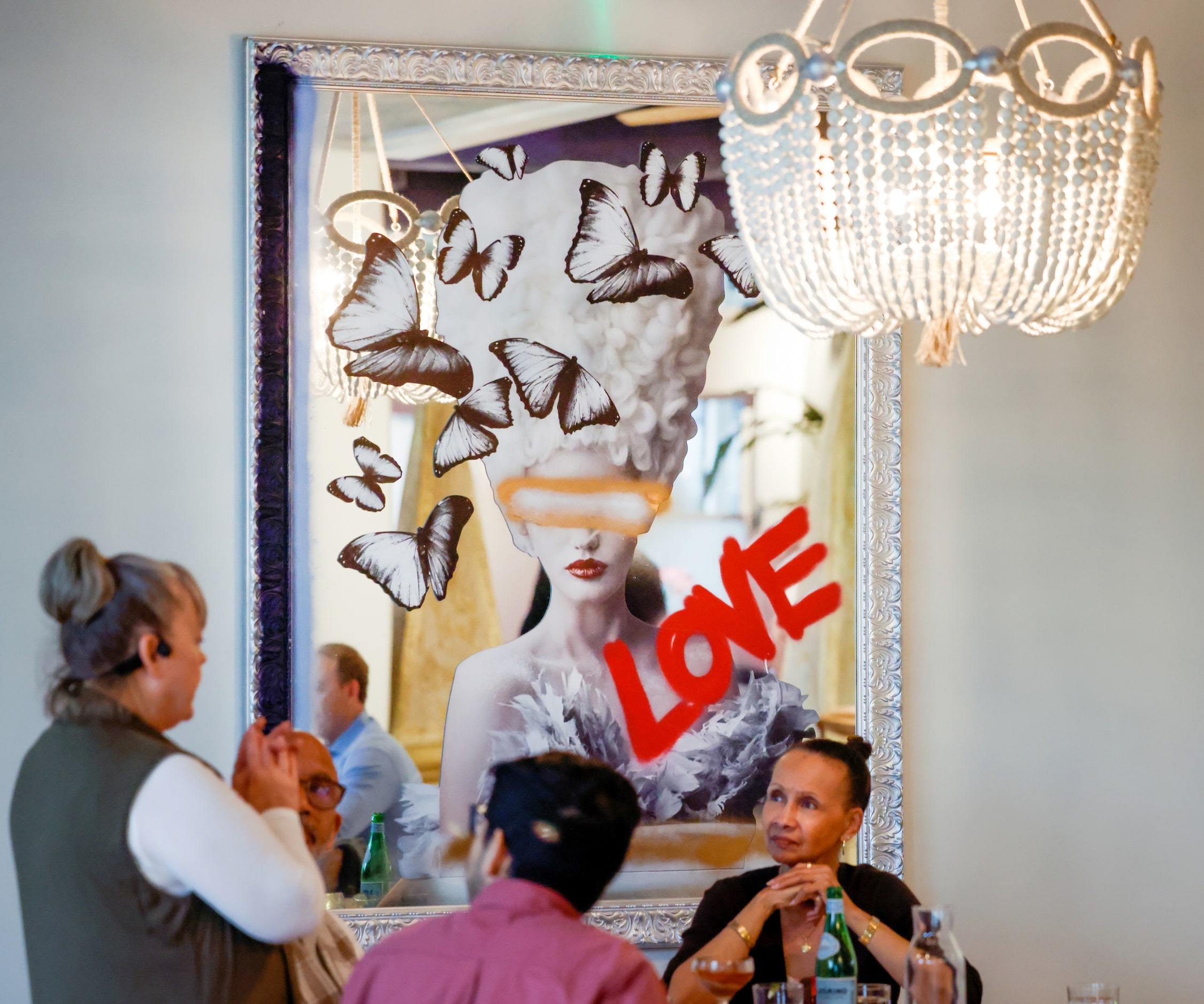 Arlington resident Teresa Lister (right) dines with friends for her birthday under one of...