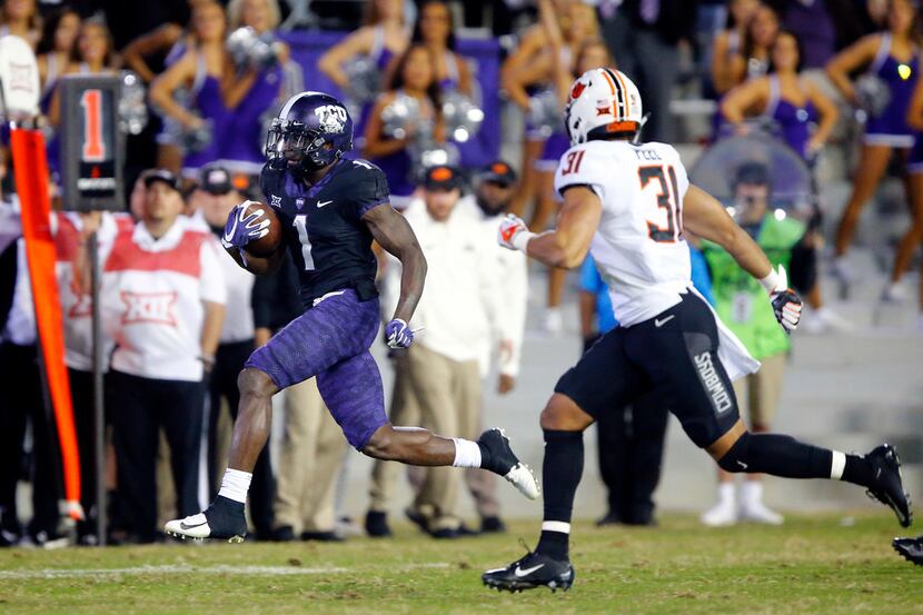 TCU Horned Frogs wide receiver Jalen Reagor (1) breaks away from Oklahoma State Cowboys...