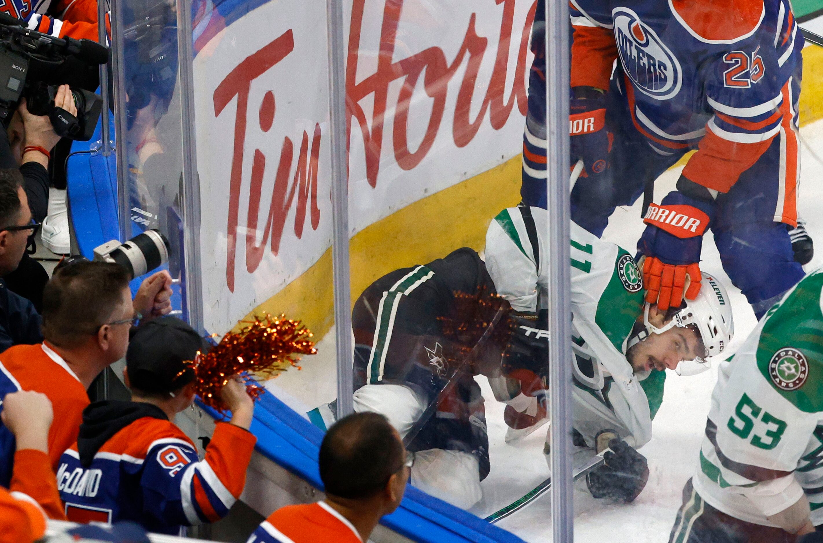 \Edmonton Oilers defenseman Darnell Nurse (25) drops Dallas Stars center Logan Stankoven...