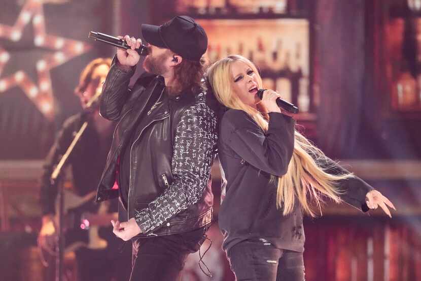 Nate Smith (left) and Avril Lavigne performed "Bulletproof" during the 59th annual Academy...