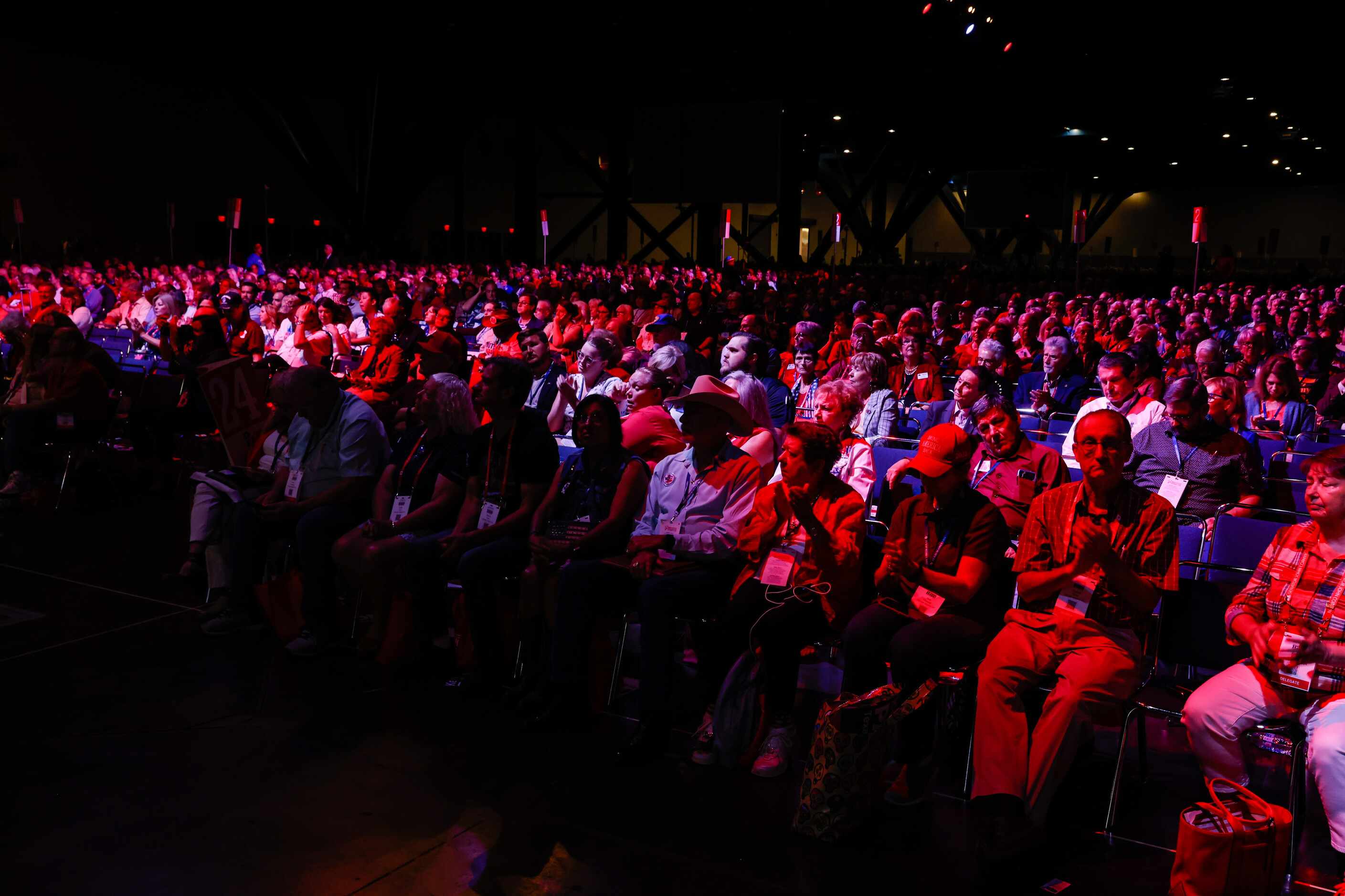 Attendees applaud as Lieutenant Governor of Texas Dan Patrick gives a speech during a...