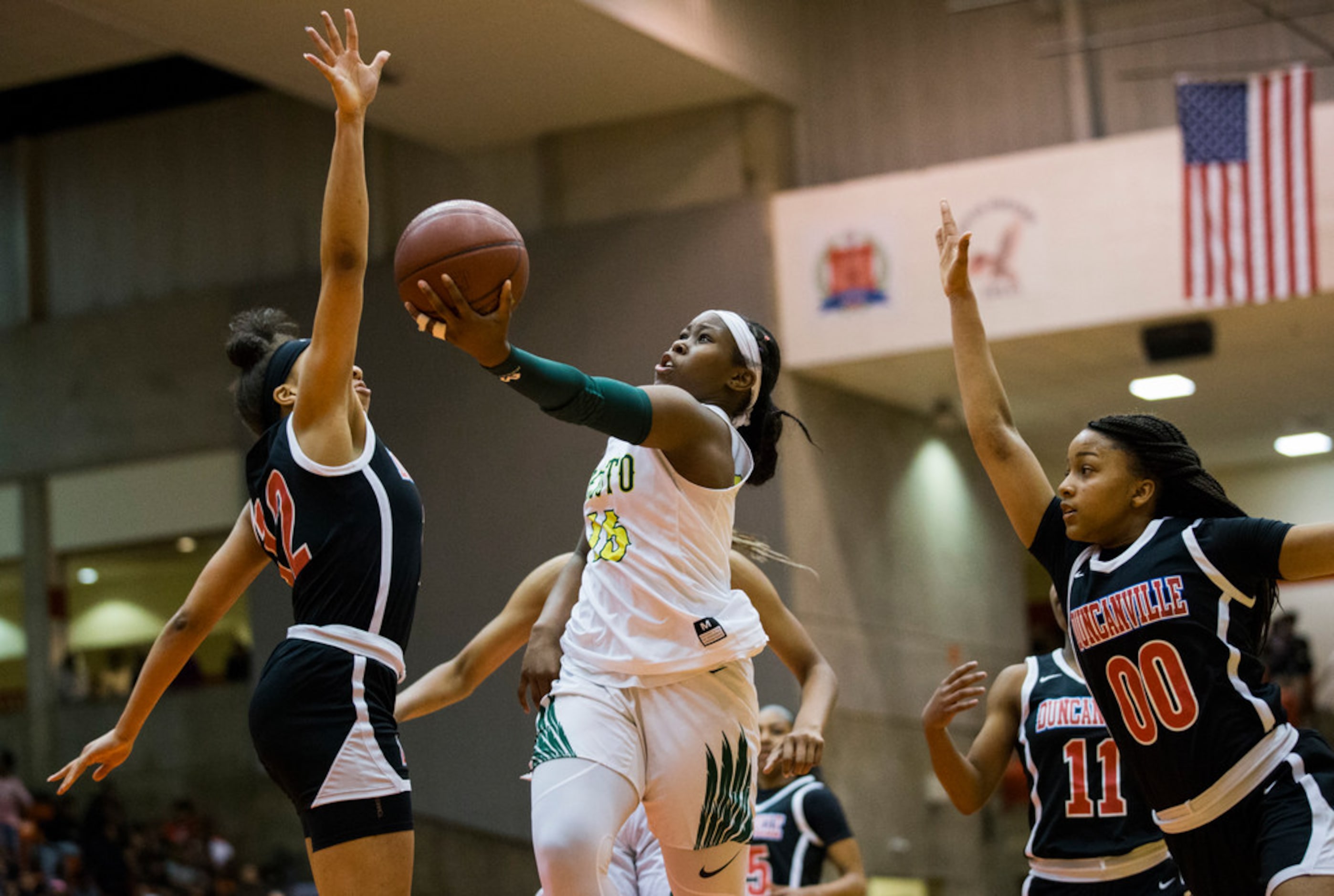 DeSoto's Michayla Gatewood (15) goes up for a shot that's blocked by Duncanville's Zaria...