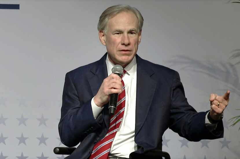 In this screen grab, Texas Governor Greg Abbott (right) speaks during a plenary keynote...