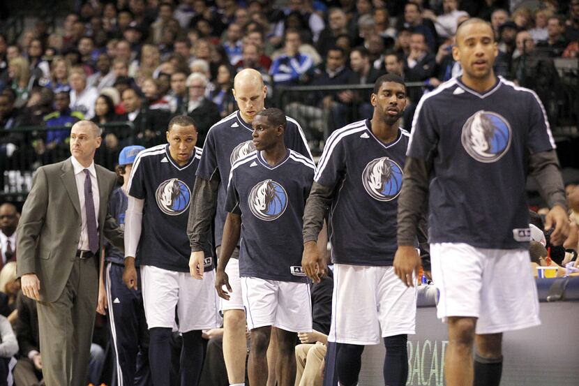Dallas Mavericks head coach Rick Carlisle, left, replaces all his players on the floor in...