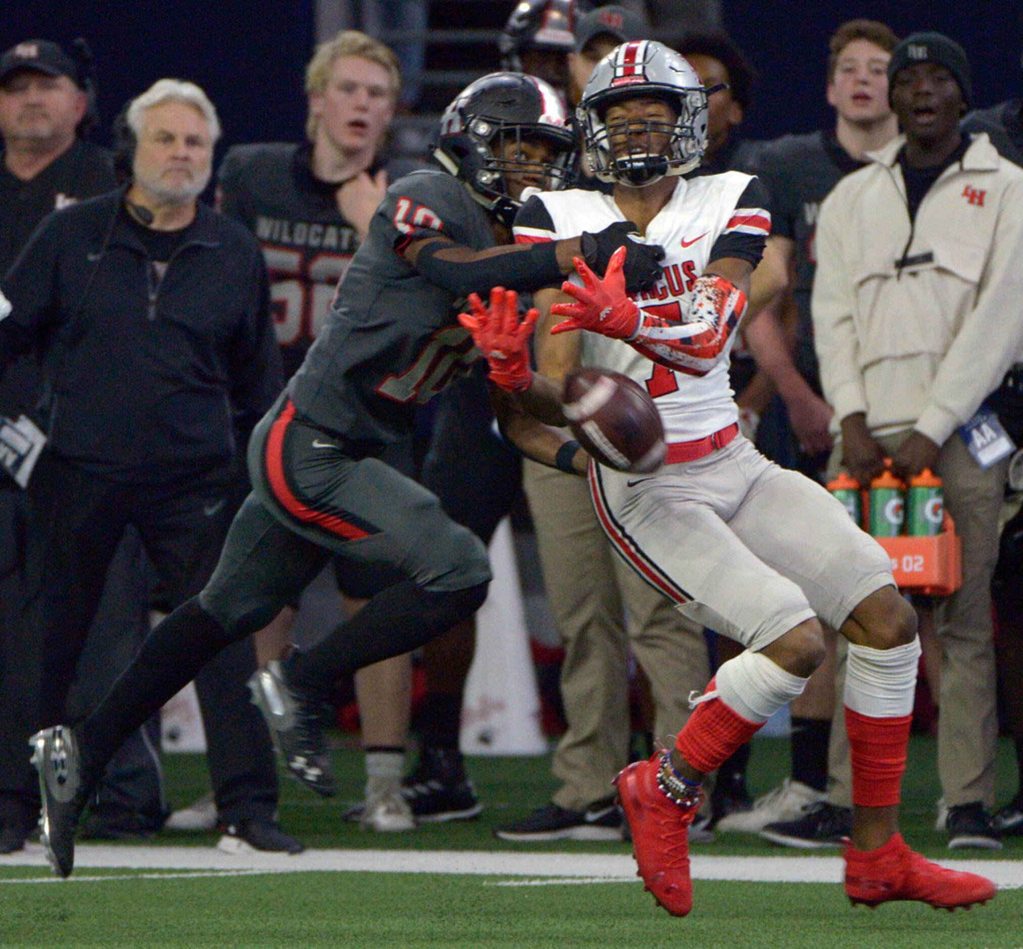 Flower Mound Marcus' J. Michael Sturdivant (7) can't hold onto the pass as he's defended by...