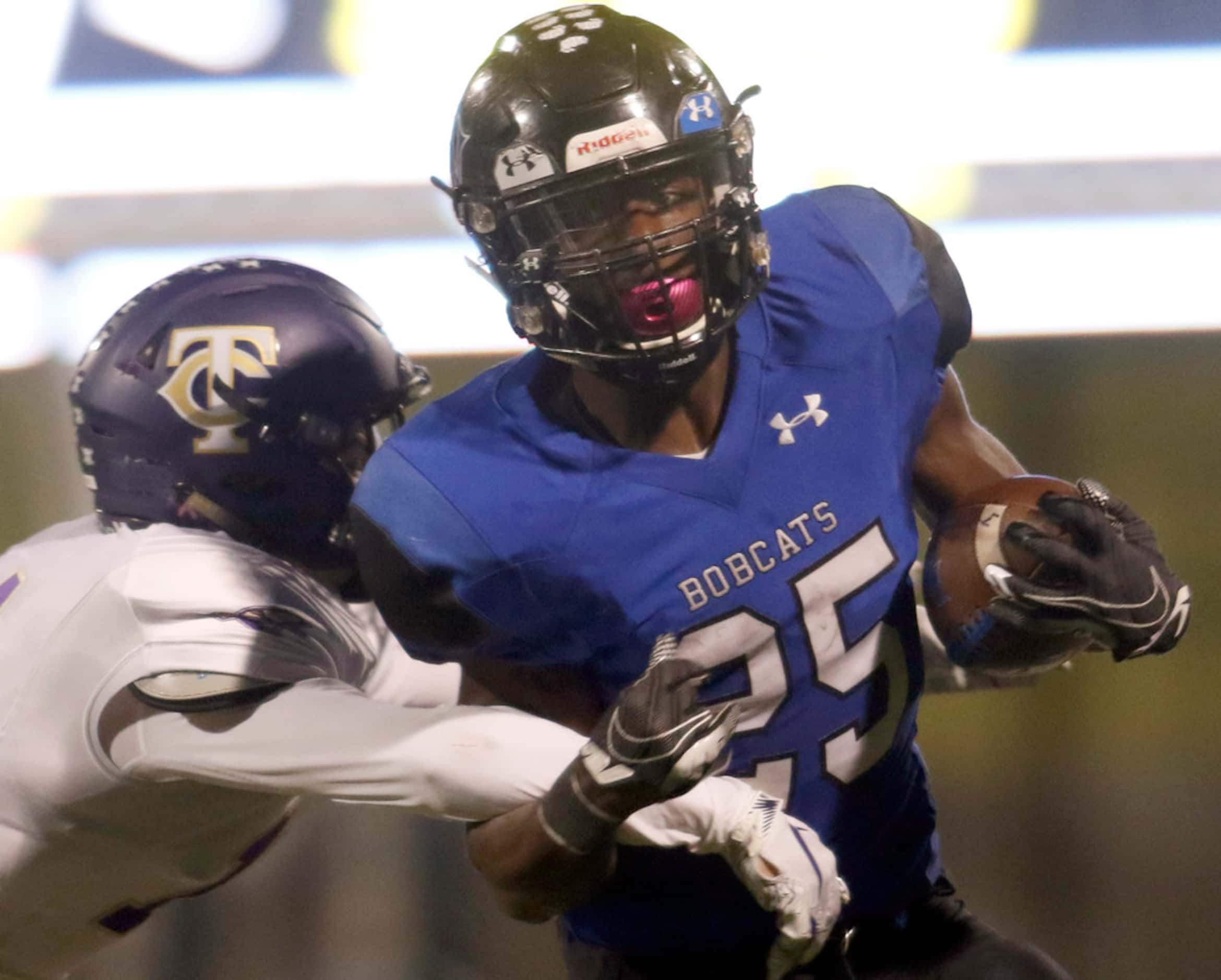 Trophy Club Byron Nelson running back Maxwell Modeste (25) is unable to elude the tackle of...
