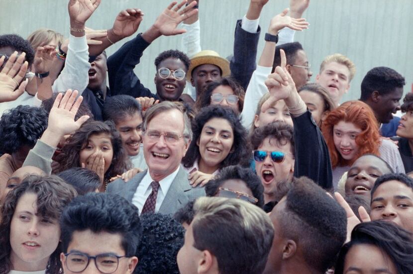 In 1990, President George H.W. Bush was surrounded by cheering students from the Independent...