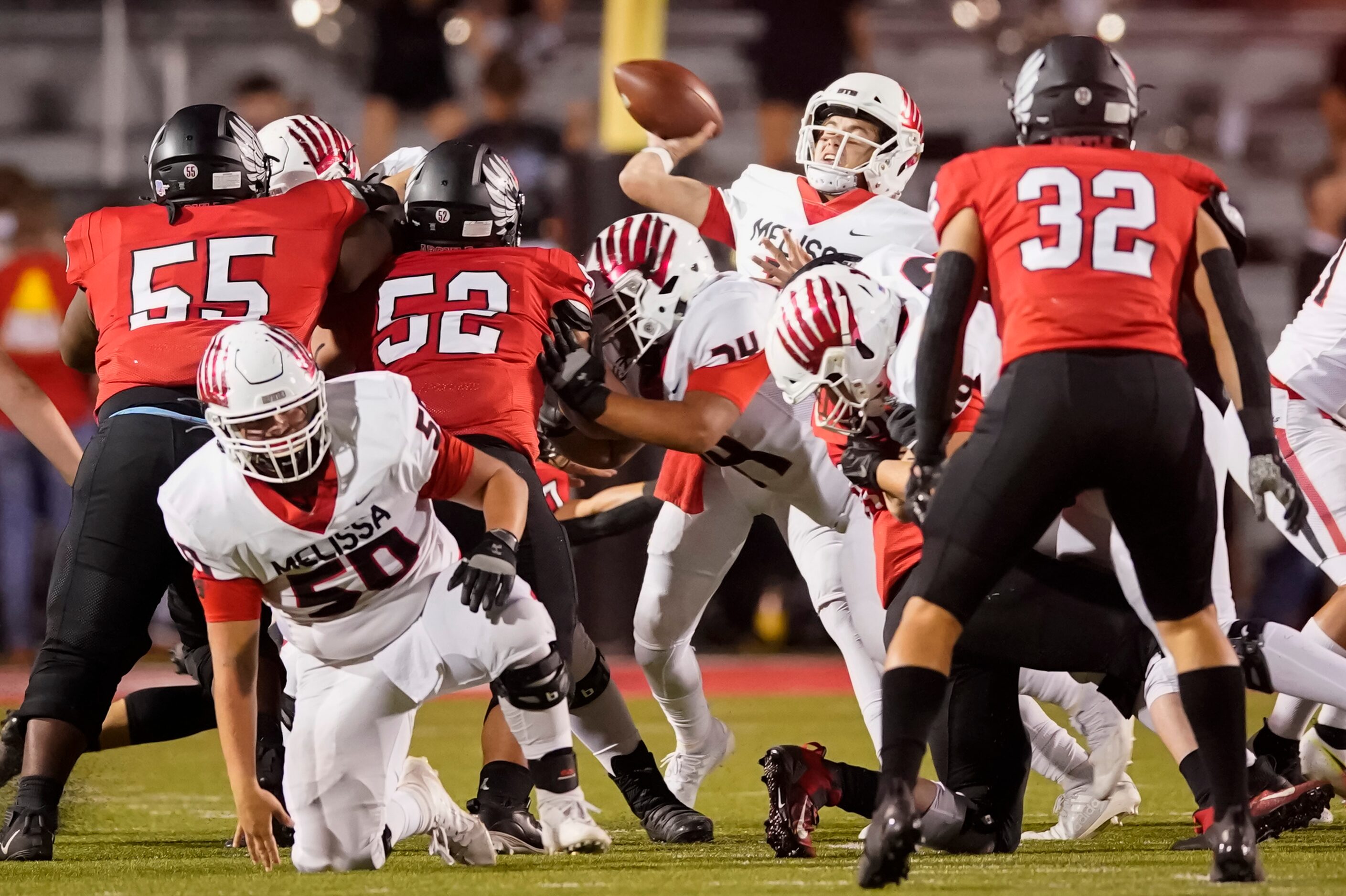 Melissa quarterback Sam Fennegan gets off a pas under pressure from the Argyle defense...