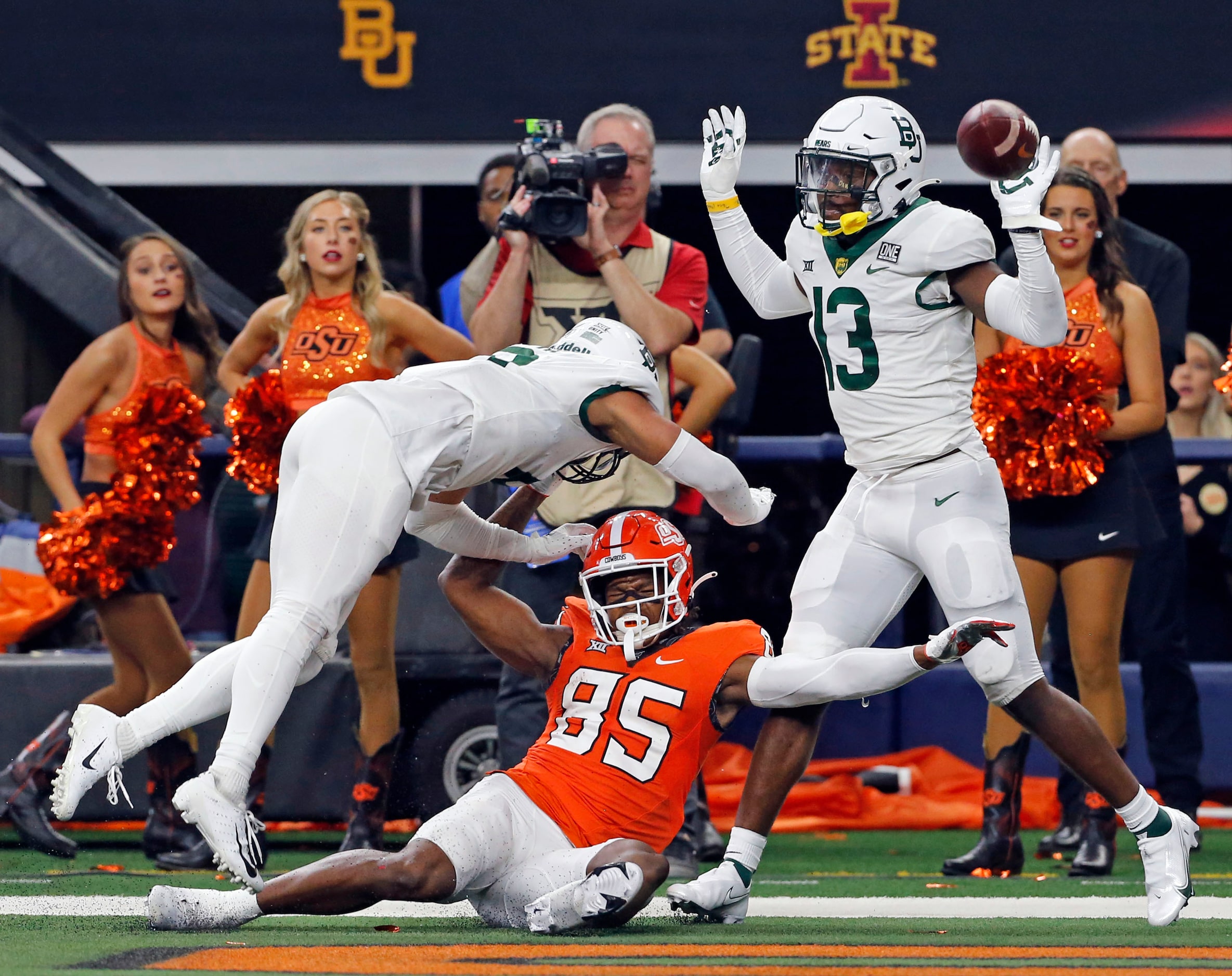 Baylor Bears safety Jalen Pitre (8) and Baylor Bears cornerback Al Walcott (13) manhandle...