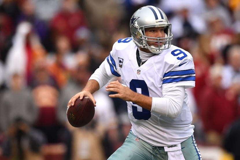 LANDOVER, MD - DECEMBER 28: Quarterback Tony Romo #9 of the Dallas Cowboys looks to pass...