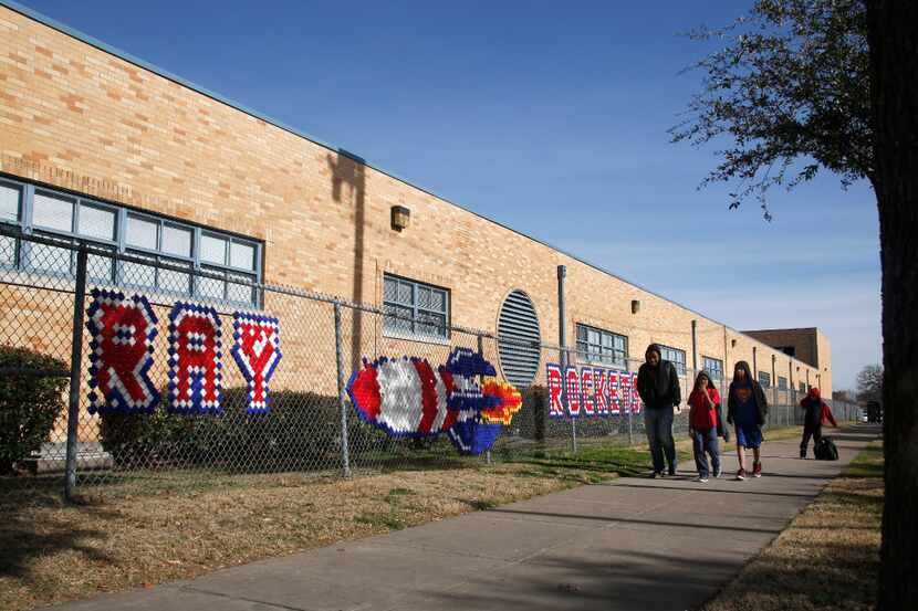 Studendts leave J. W. Ray Learning Center at the end of the school day in Dallas, Feb. 7,...