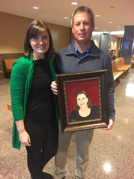 Caitlin Martin-Linduff and Don Martin were presented with a hand-painted portrait of Kellie...