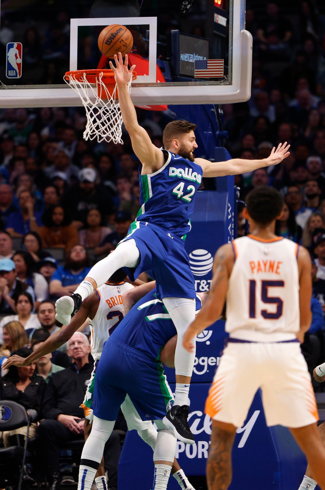 Dallas Mavericks forward Maxi Kleber (42) collides with guard Luka Doncic (77) at the basket...