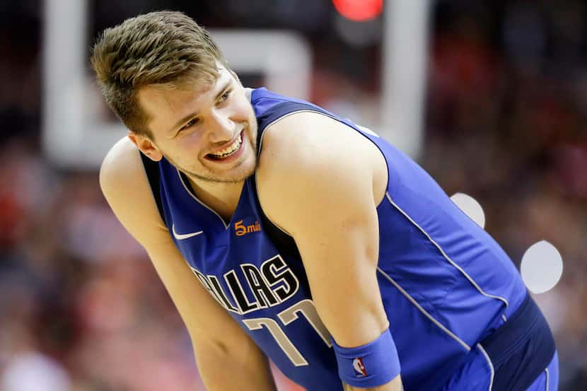 Dallas Mavericks forward Luka Doncic reacts after being called for a foul late in the second...
