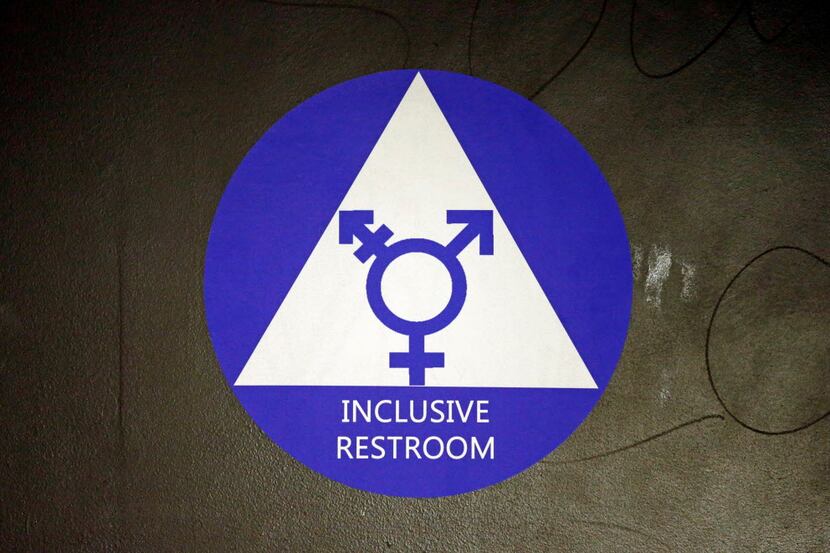 In this May 17, 2016, file photo, a new sticker designates a gender neutral bathroom at...