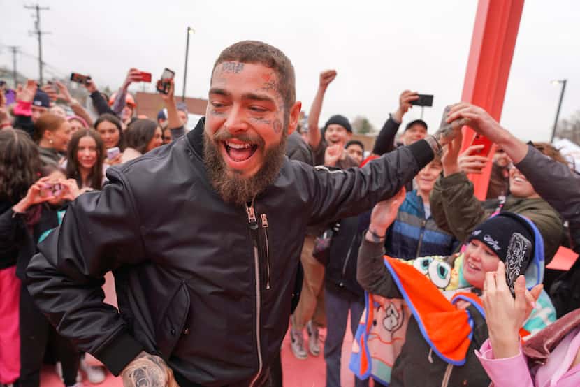 Post Malone was on hand Thursday for Raising Cane's grand opening in Midvale, Utah. It's a...