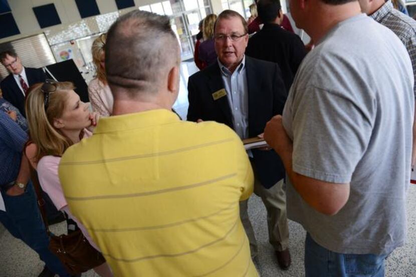Rockwall County Commissioner David Magness talks to residents about the proposed expansion...