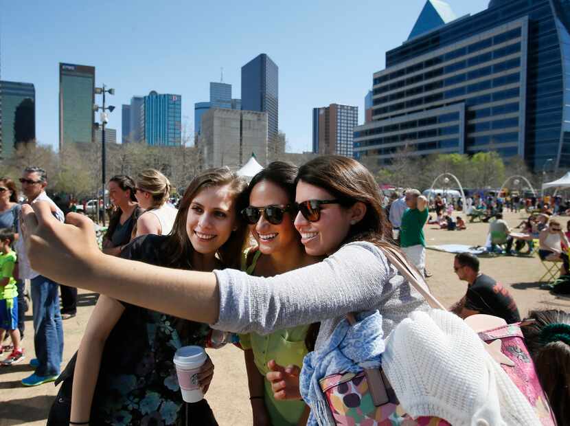 Visitors take a photo of themselves at Klyde Warren Park in 2014. 