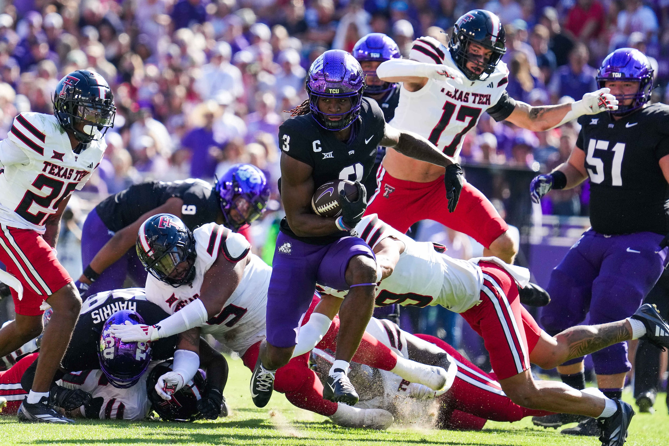 TCU wide receiver Savion Williams (3) breaks through the Texas Tech defense on a 35-yard...