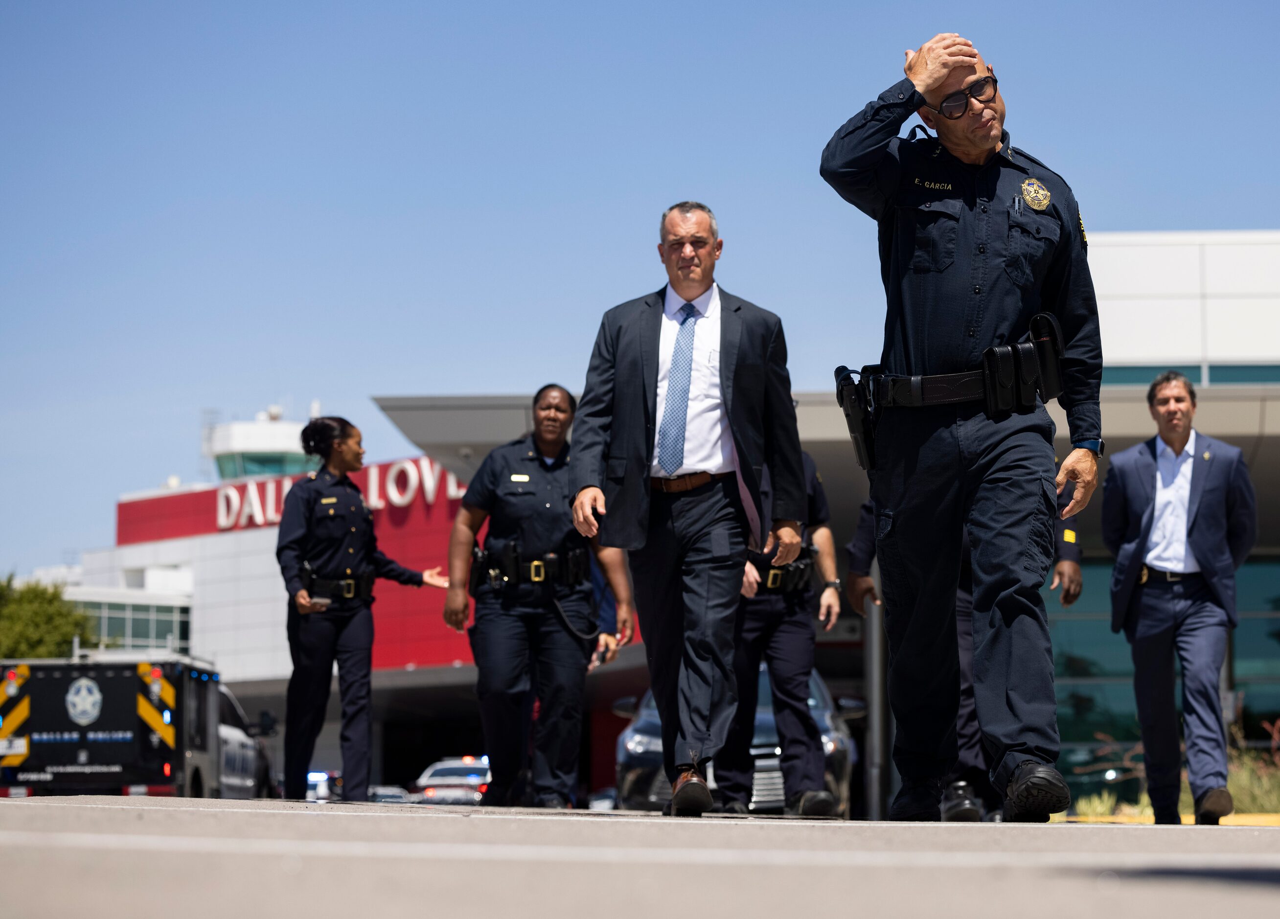 Dallas Police Chief Eddie García walks to talk to the press as Dallas police investigate...