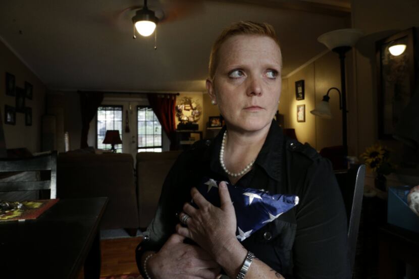 “You cannot imagine the pain, to actually be shut out,” says Tracy Dice Johnson, clutching a...