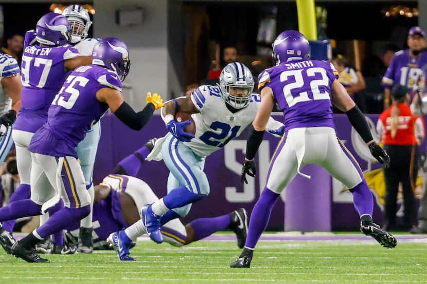 Dallas Cowboys running back Ezekiel Elliott (21) runs the ball at Minnesota Vikings safety...