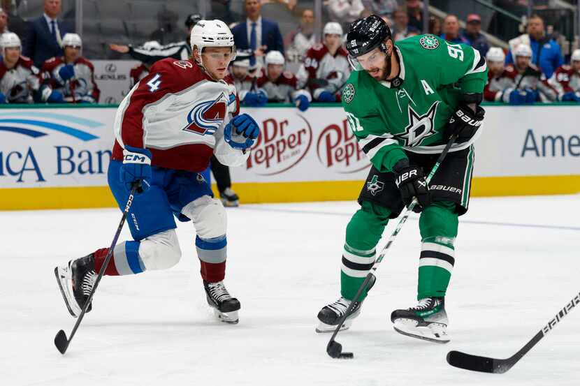 Dallas Stars center Tyler Seguin (91) skates away from Colorado Avalanche defenseman Bowen...