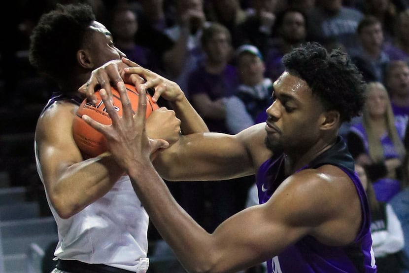 Kansas State guard Kamau Stokes, left, rebounds against TCU center Russell Barlow, right,...