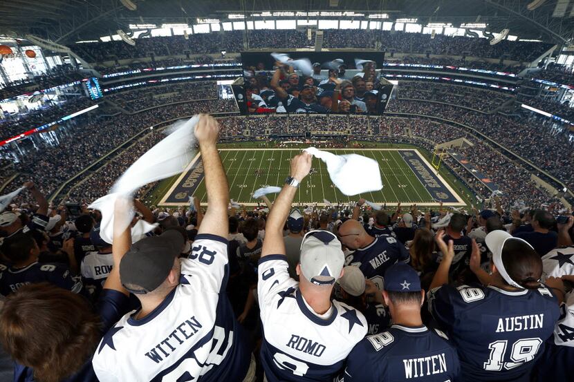 Dallas Cowboys fans waves their spirit towles from the top row as the Dallas Cowboys and...