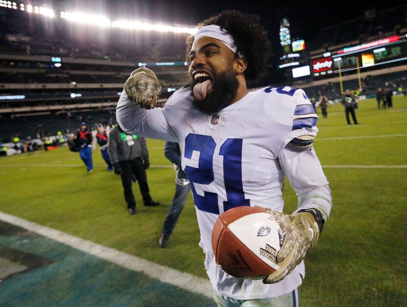 With the NBC game ball in hand, Dallas Cowboys running back Ezekiel Elliott (21) celebrates...