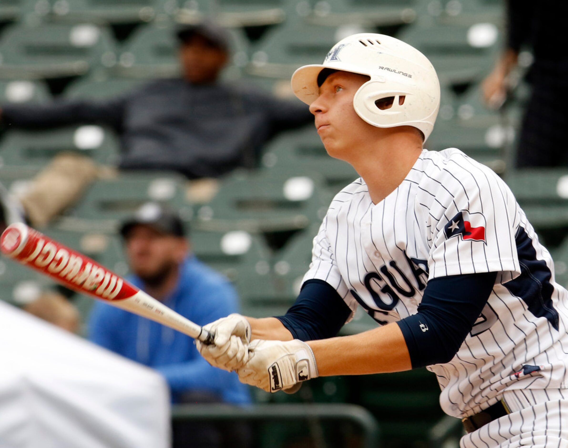 Flower Mound designated hitter Geoff Marlow (9) watches his long drive head to the left...