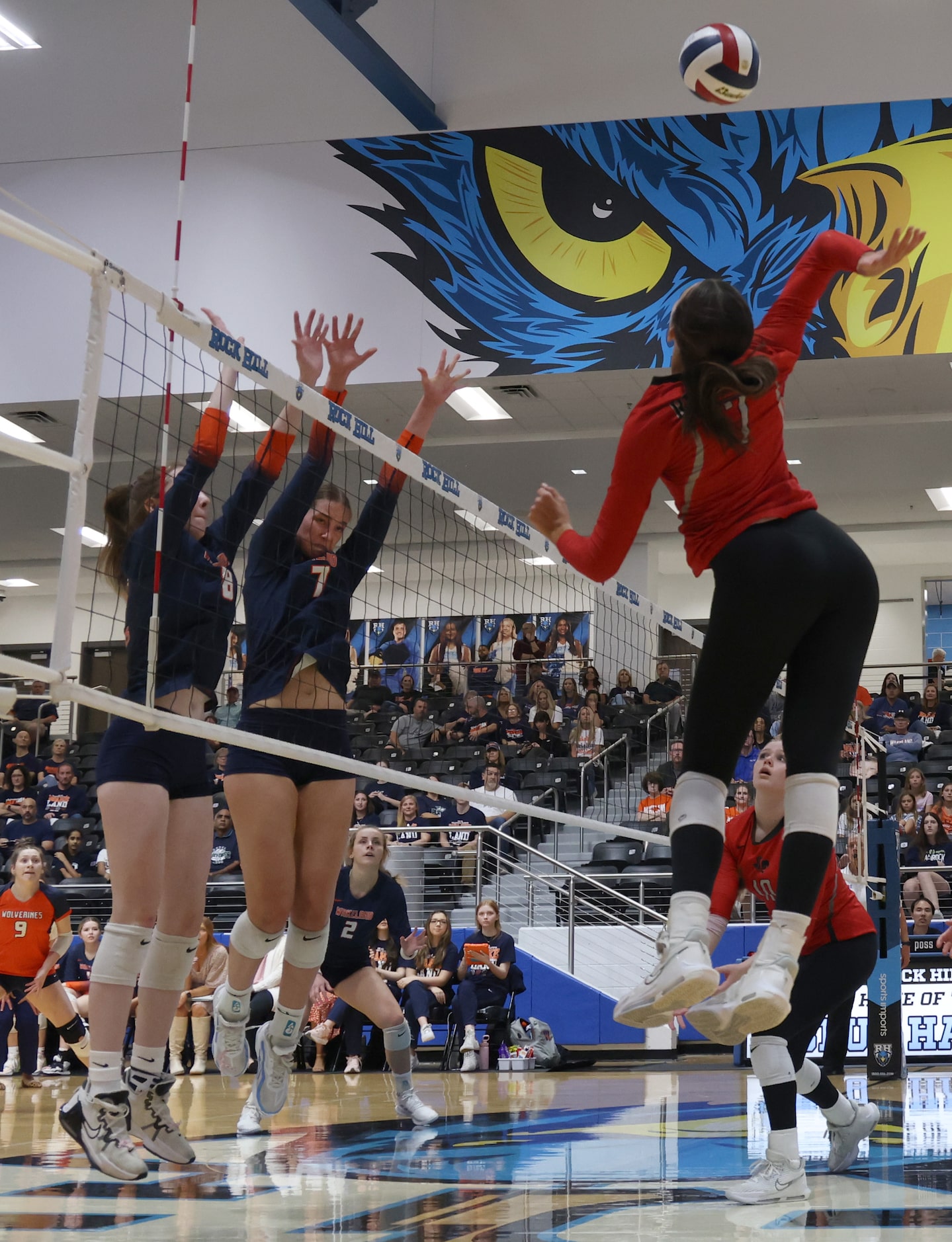 Frisco Liberty's MJ McCurdy (7), right, skies to spike over the defense of Frisco Wakeland's...