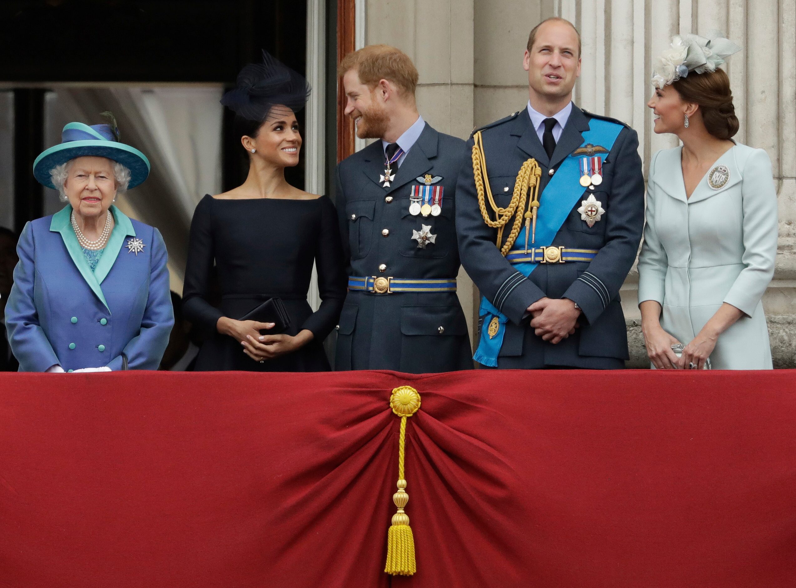 Britain's Queen Elizabeth II, and from left, Meghan the Duchess of Sussex, Prince Harry,...