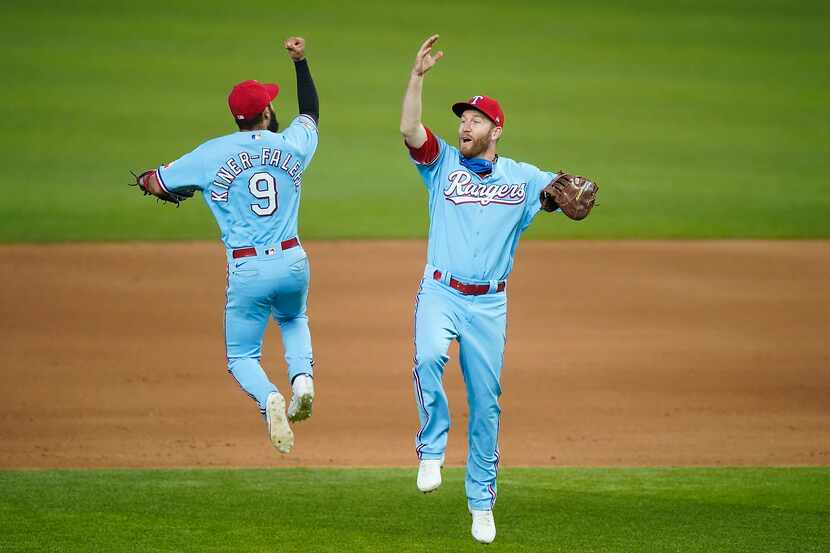 Texas Rangers third base Isiah Kiner-Falefa celebrates with first baseman Todd Frazier after...