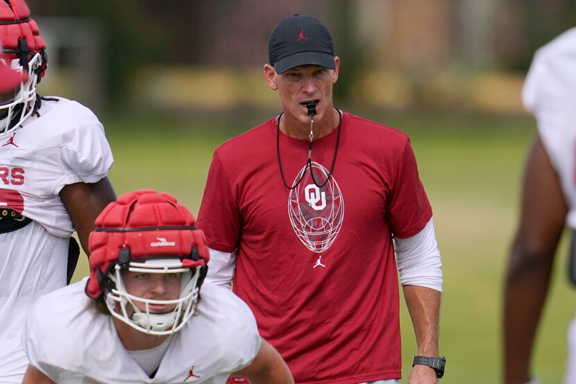 Oklahoma coach Brent Venables watches players during a drill at the NCAA college football...