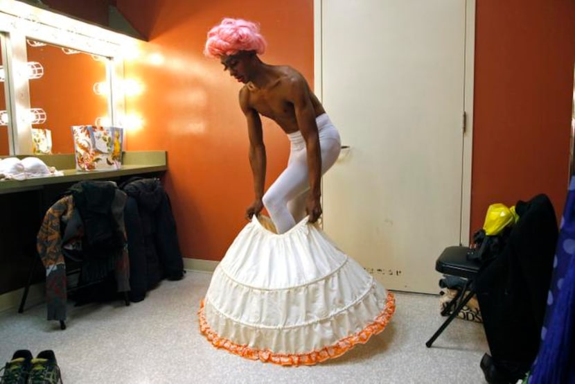 
Ivan Jones of Dallas puts on a hoop skirt as he transforms himself into Mrs. T Time as part...