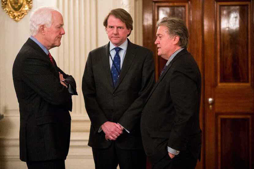 Sen. John Cornyn speaks with White House counsel Don McGahn (center) and senior adviser...