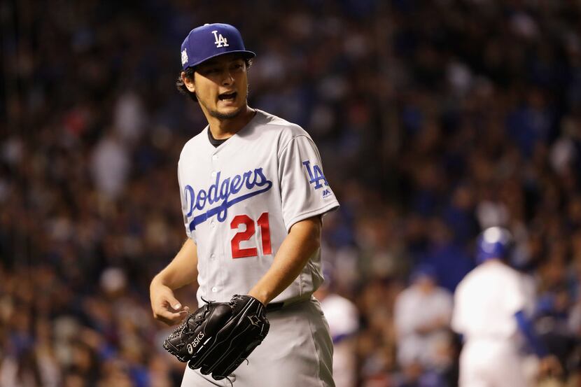 CHICAGO, IL - OCTOBER 17:  Yu Darvish #21 of the Los Angeles Dodgers walks off the field...