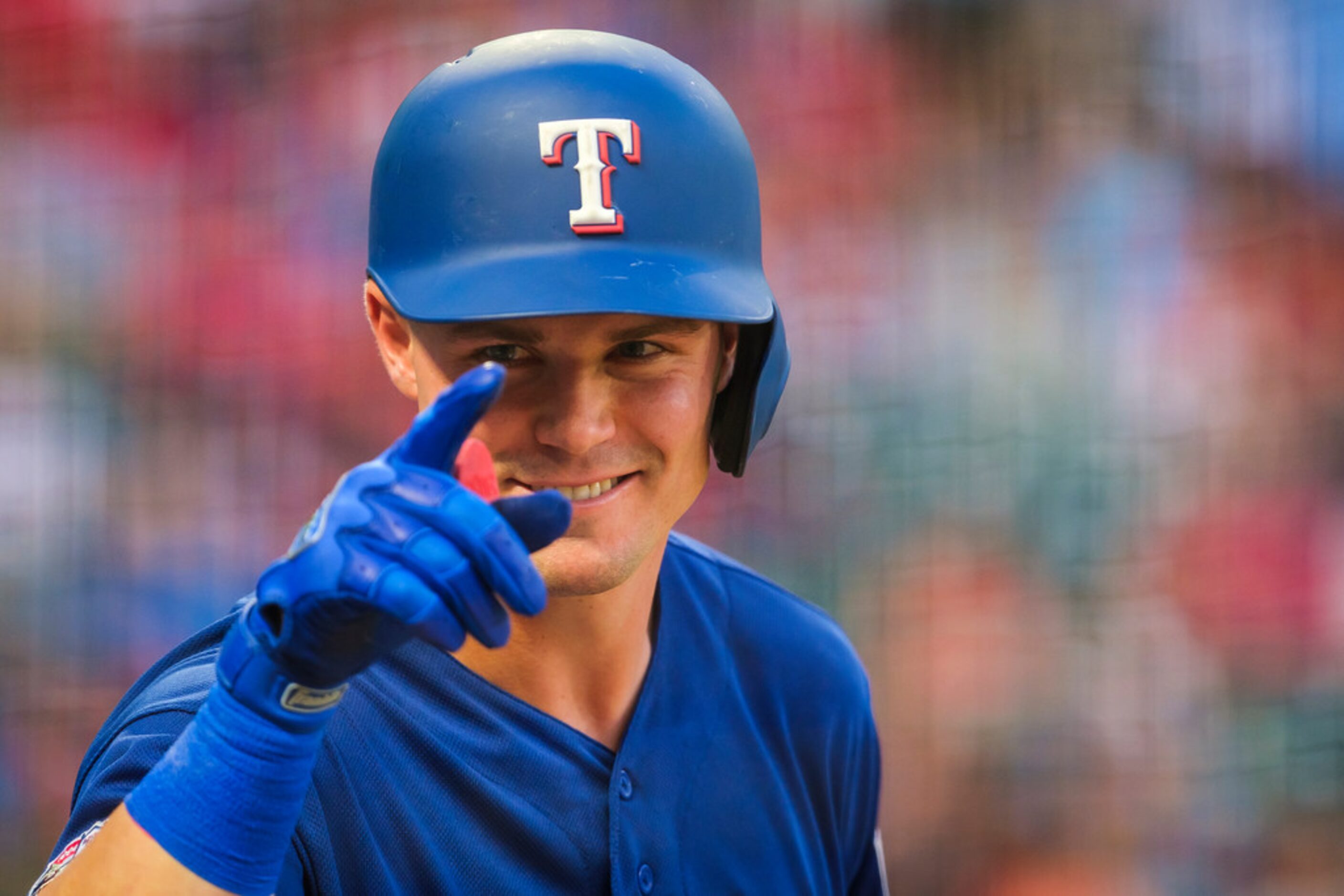 Texas Rangers outfielder Scott Heineman acknowledges former Ranger Ivan Rodrâguez before...