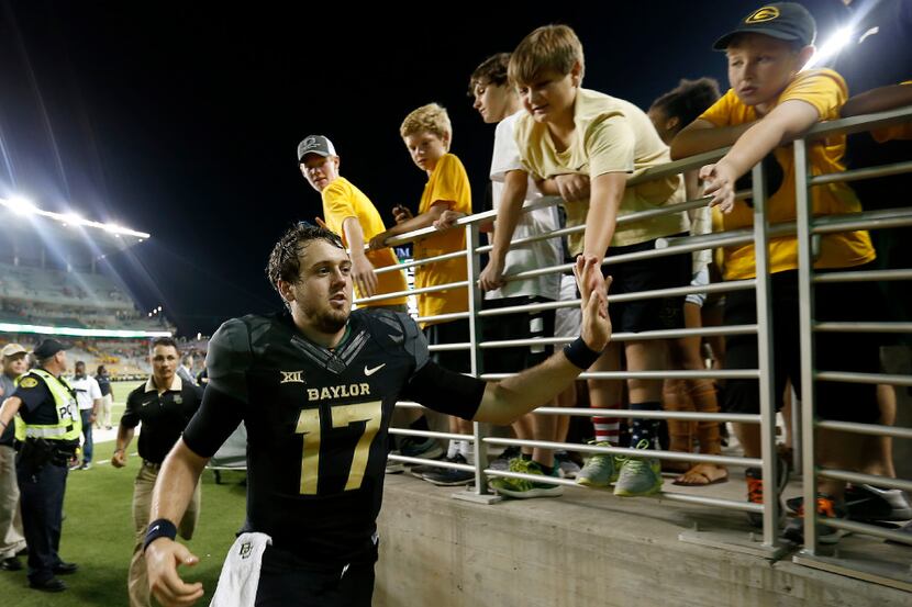 Baylor quarterback Seth Russell (17) celebrates a 35-24 win over Oklahoma State with fans at...