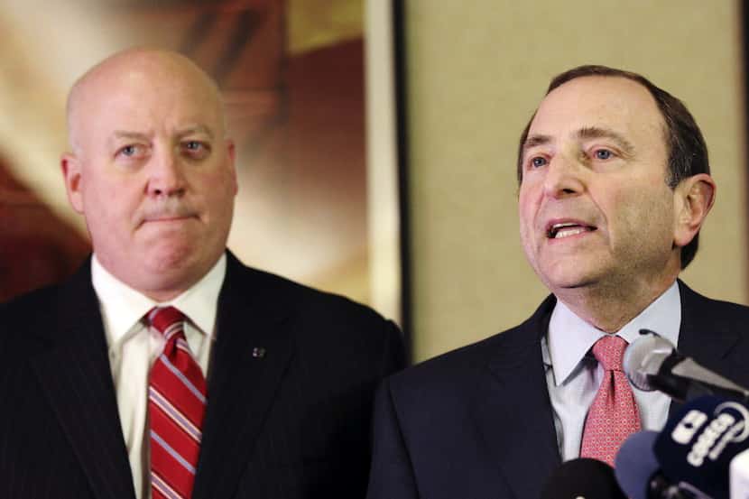 FILE - In this Dec. 6, 2012, file photo, NHL Commissioner Gary Bettman, right, and deputy...