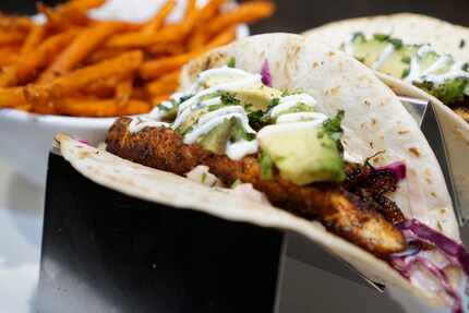 Blackened redfish tacos with sweet potato fries at Walk-On's Bistreaux & Bar in Irving