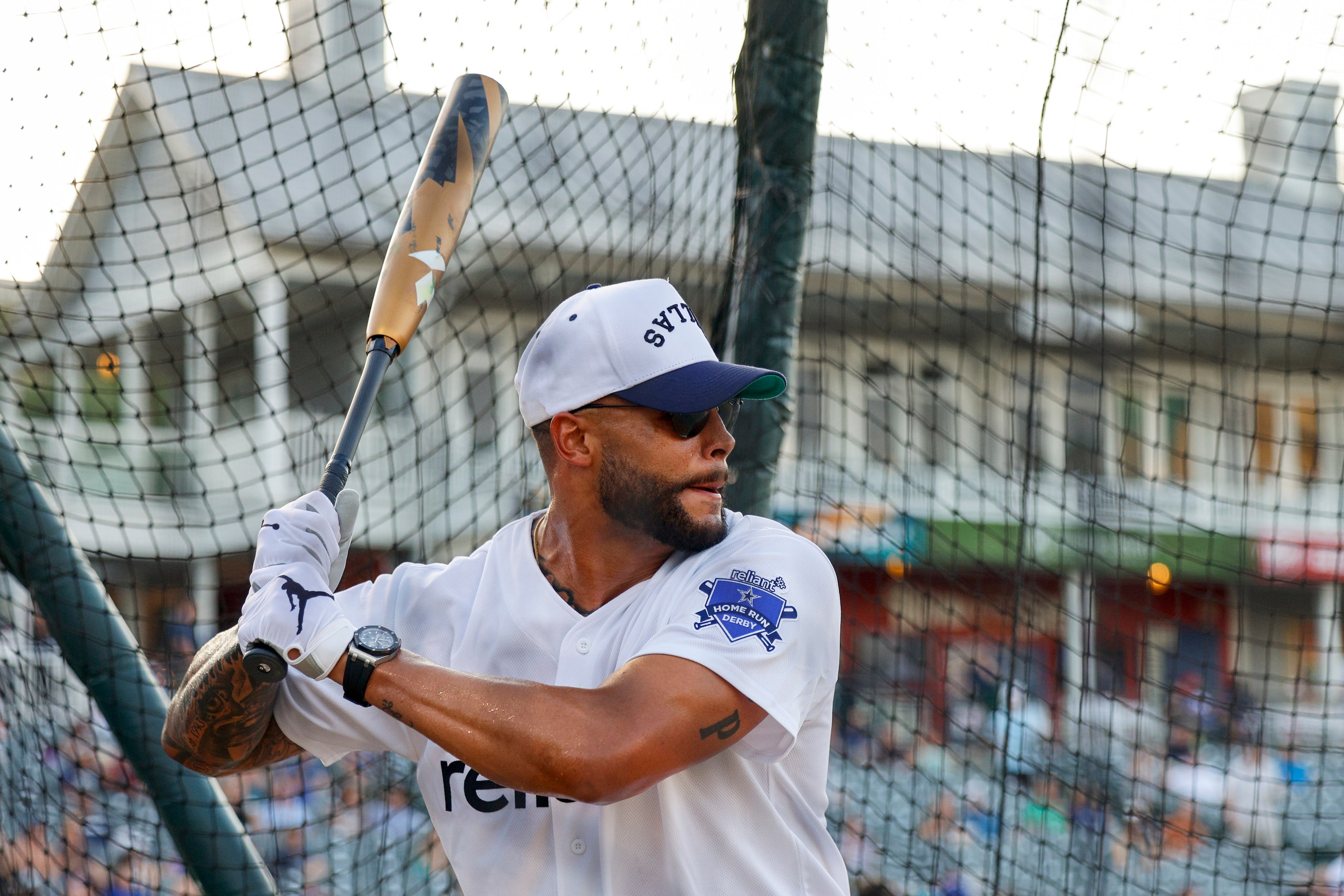 Dallas Cowboys quarterback Dak Prescott waits for a pitch during the Reliant Energy Home Run...