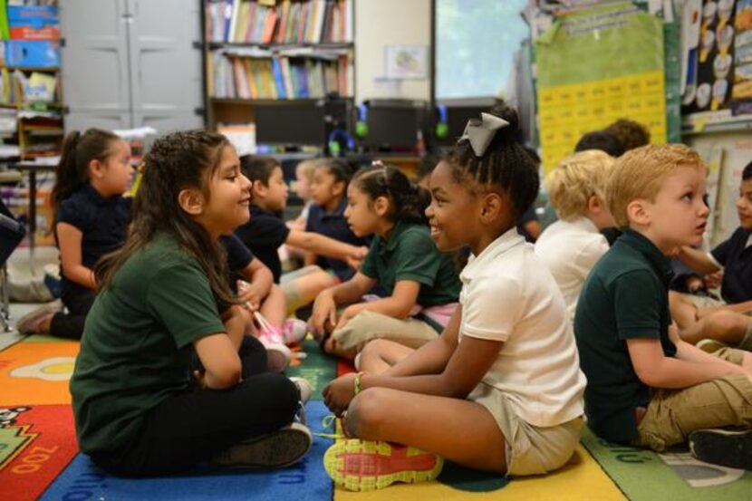 
Dulce Cardoso (right) and Caiden Goodnight practice English words in class.
