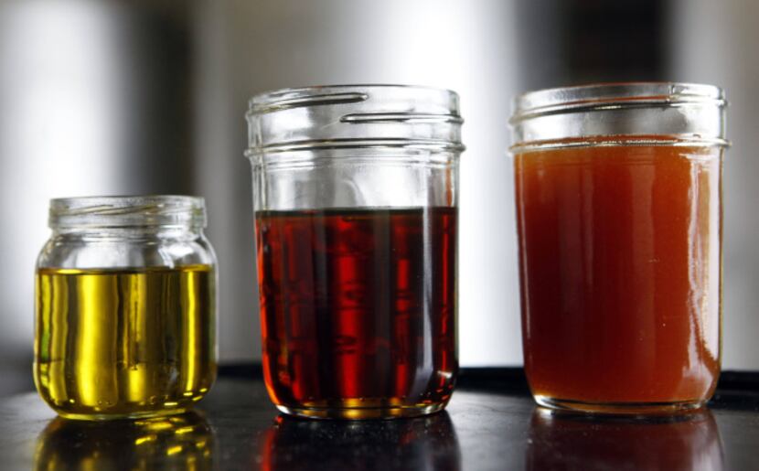 Sample jars hold (from left) processed biodiesel, filtered soybean oil, and unfiltered...