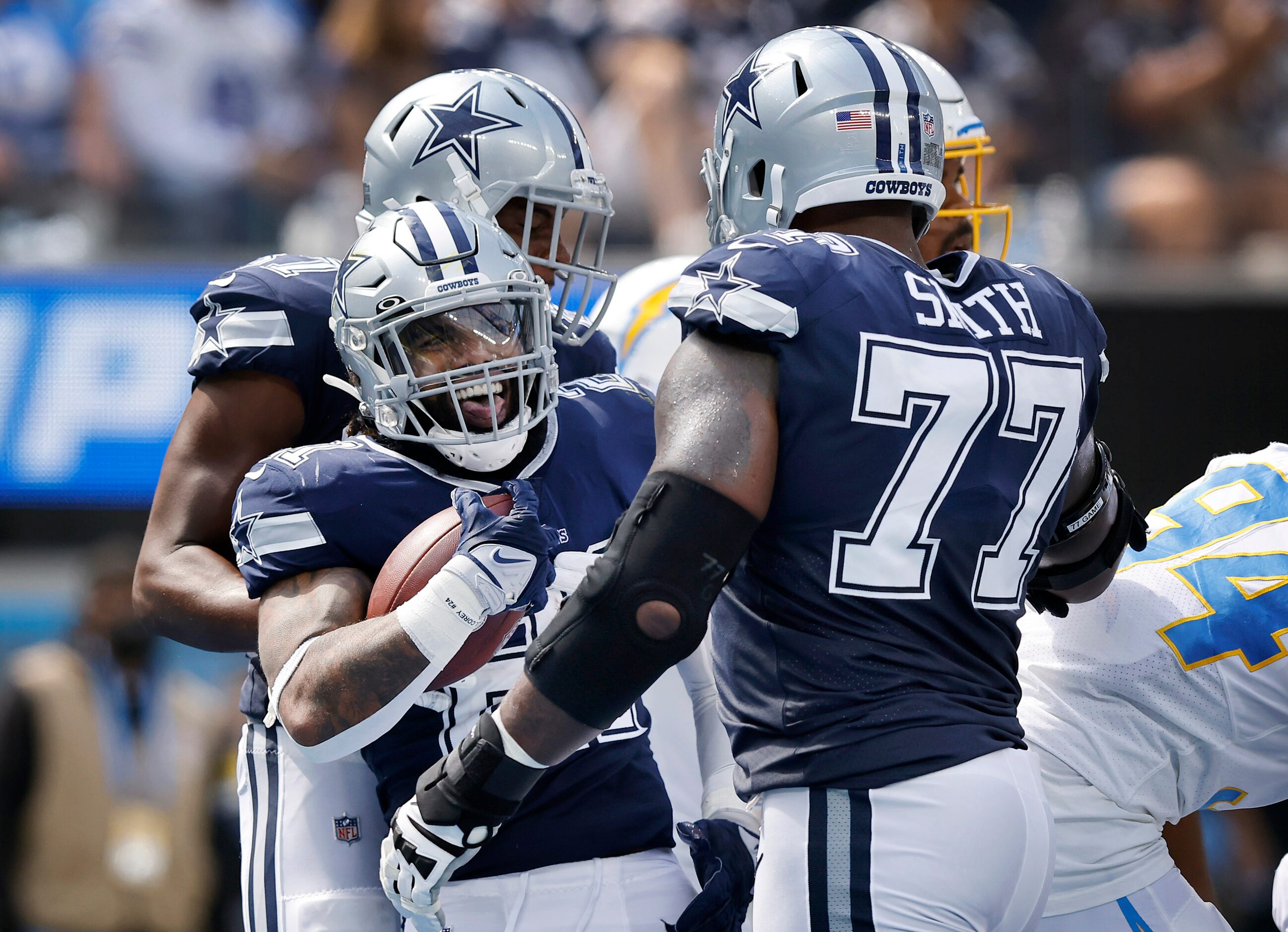 Dallas Cowboys running back Ezekiel Elliott (21) celebrates his first quarter touchdown run...