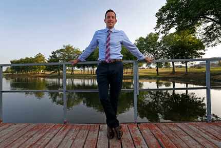 Michael Kowski , standing at Towne Lake Recreation Area, is director of parks and recreation...