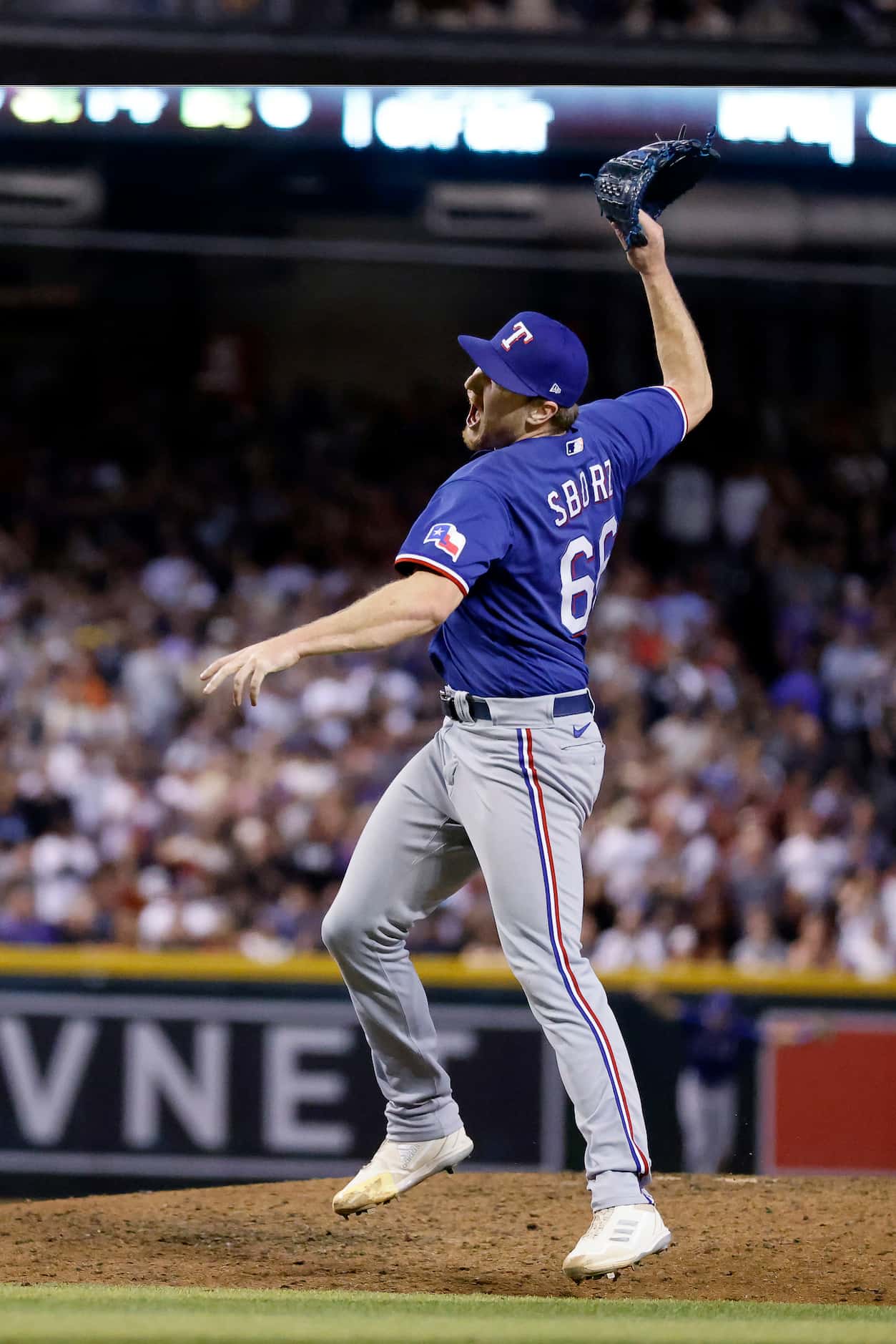 Texas Rangers relief pitcher Josh Sborz (66) throws down his glove after making the final...